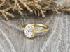 Demi 1.0 Ct Oval Cut Halo Engagement Ring with Side Stones