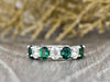 Ivy 2.5 Ct Oval Cut Moissanite and Green Emerald Half Eternity Wedding Band