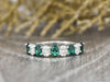 Ivy 1.5 Ct Oval Cut Moissanite and Green Emerald Half Eternity Wedding Band