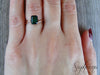 Viola 1.2 Ct Twisted Solitaire Emerald Cut Green Emerald Engagement Ring